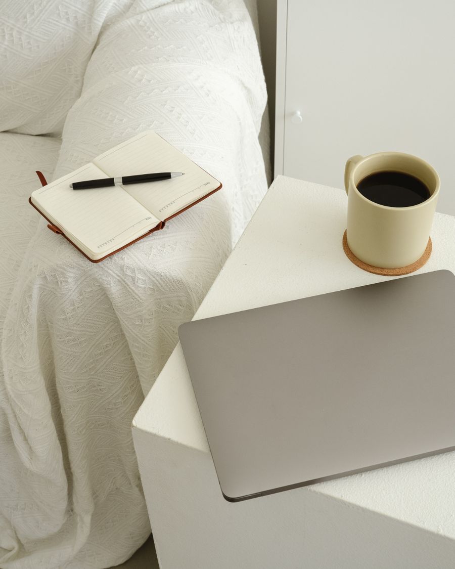 A cosy coffee and journal moment representing the member community